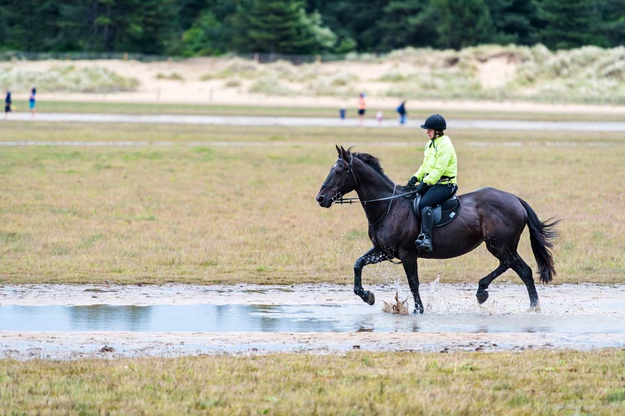Horseriding on the beach at Holkham, in north Norfolk - on the England Coast Path